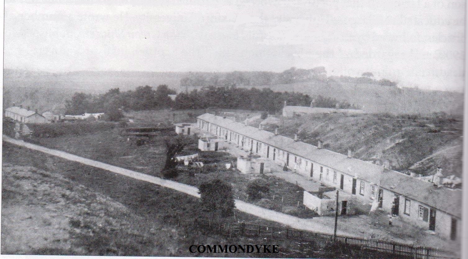 Village of Commondyke Ayrshire shown as a row of houses to the right with visible washhouses in gardens and surrounded by countryside and other rows in the distance